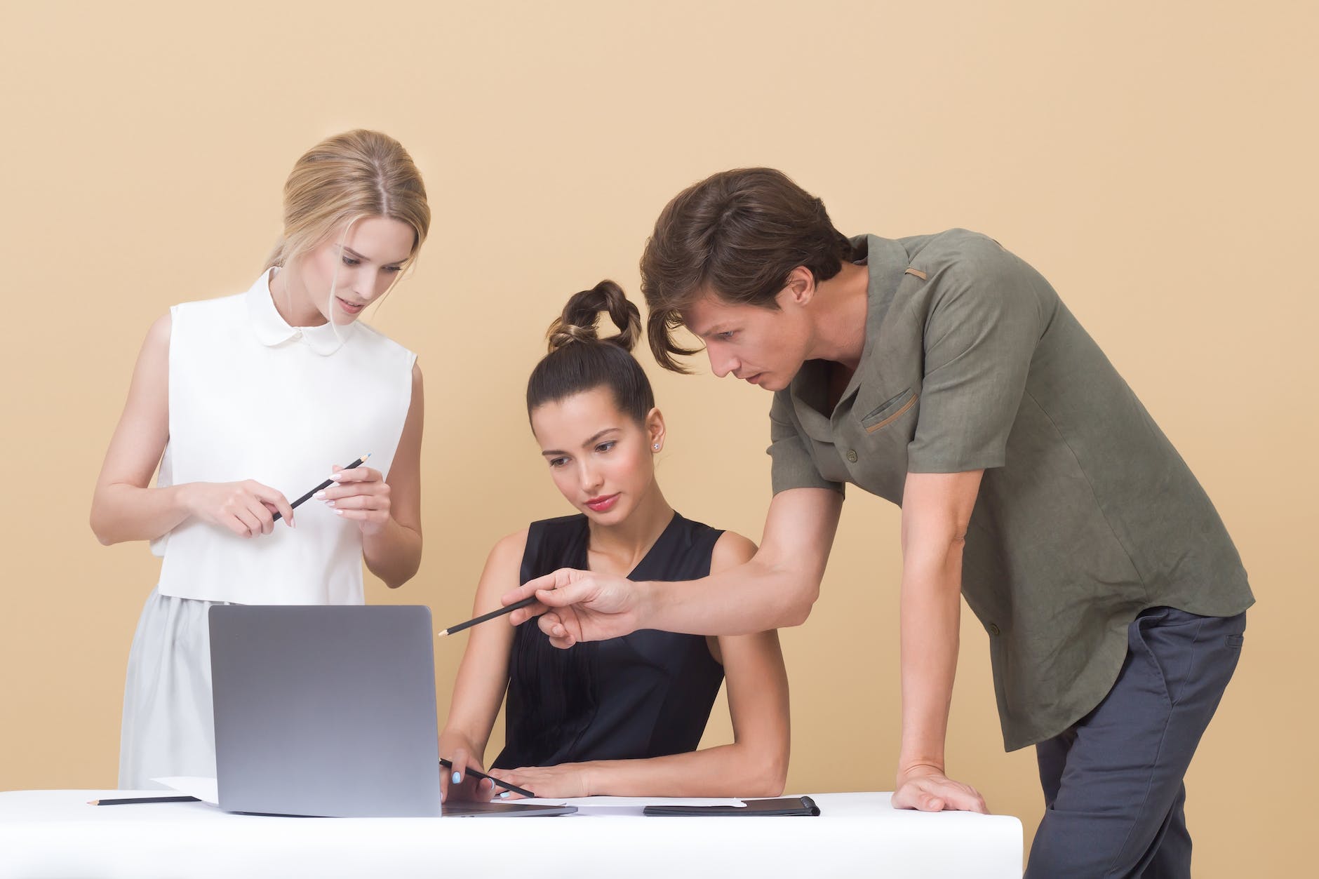 colleagues looking at laptop